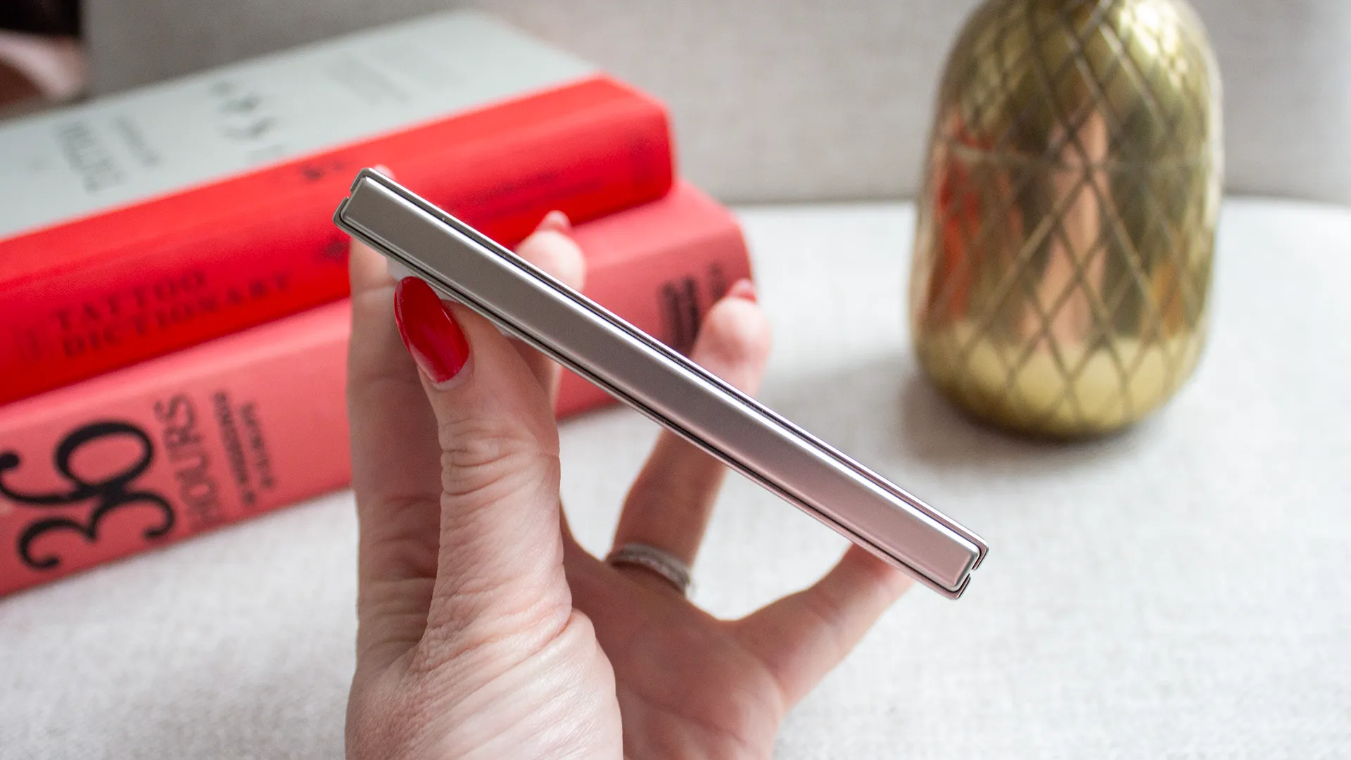 Close-up of an Apple iPhone Duo showing a visible gap between the back panel and hinge when closed