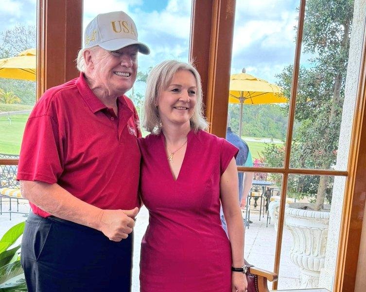 Liz Truss and Donald Trump meeting at Mar-a-Lago, discussing politics and diplomacy with a sense of camaraderie and mutual respect, as they analyse the current landscape and consider opportunities for cooperation