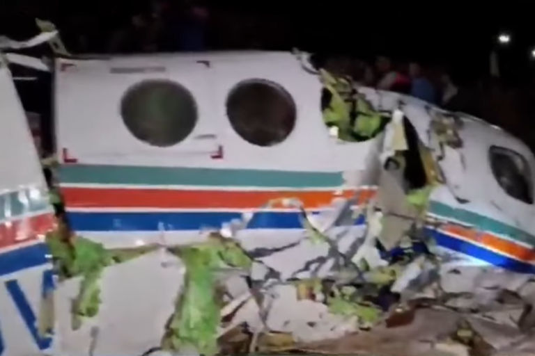 Air ambulance crash site in dense forest, with rescue teams and investigators working to determine the cause of the accident, highlighting the importance of air ambulance safety