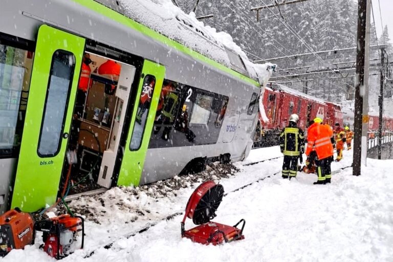 Aerial view of the avalanche affected area in Switzerland, with rescue teams and emergency services on the scene, highlighting the primary keyword 'avalanche' and the colour of the warning flags