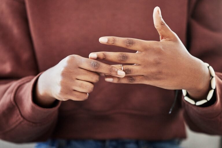 A woman standing alone, looking out at a beautiful landscape, symbolising freedom and new beginnings, with a mix of colour and light, representing a bright and hopeful future, and a chance to rediscover oneself after a toxic marriage