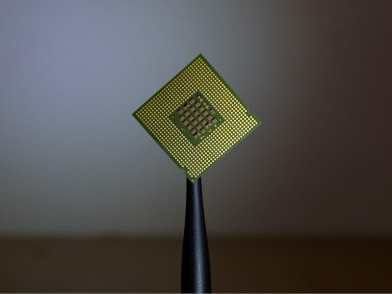 The world's smallest ferroelectric transistor with a 1-nanometer gate, featuring a nanoscale design that breaks the voltage barrier between memory and logic, enabling faster and more efficient AI data transfer with reduced energy cost, and made possible by innovative nanoscale technology and careful analysis of ferroelectric materials
