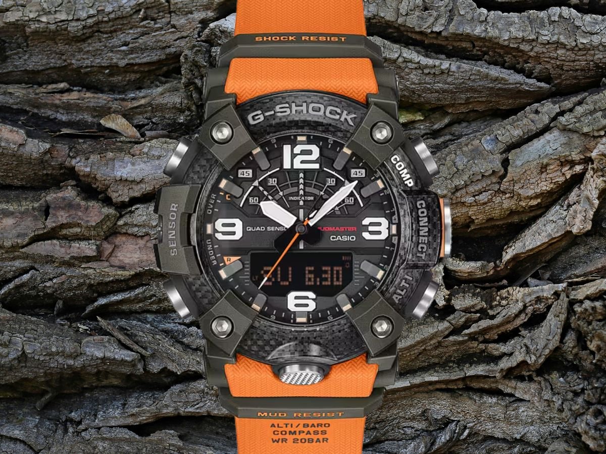 The Casio G-Shock Mudmaster watch with Quad Sensor technology, featuring a digital compass and thermometer, set against a backdrop of rugged outdoor scenery, showcasing its durability and resistance to harsh environments, perfect for outdoor enthusiasts who value precision and style