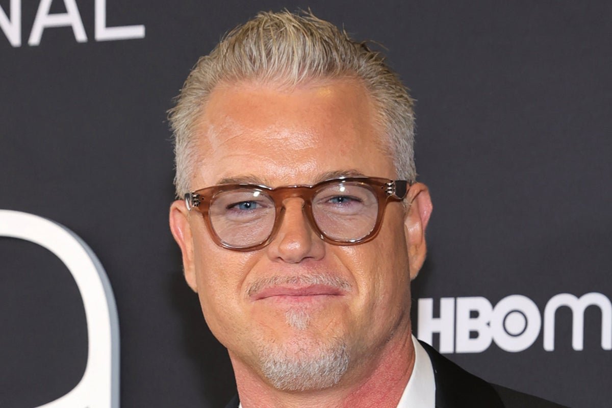 Eric Dane smiling on the red carpet, surrounded by fans and flashing cameras, a testament to his enduring popularity and the impact of his work on the entertainment industry, particularly in his notable roles in Grey’s Anatomy and Euphoria