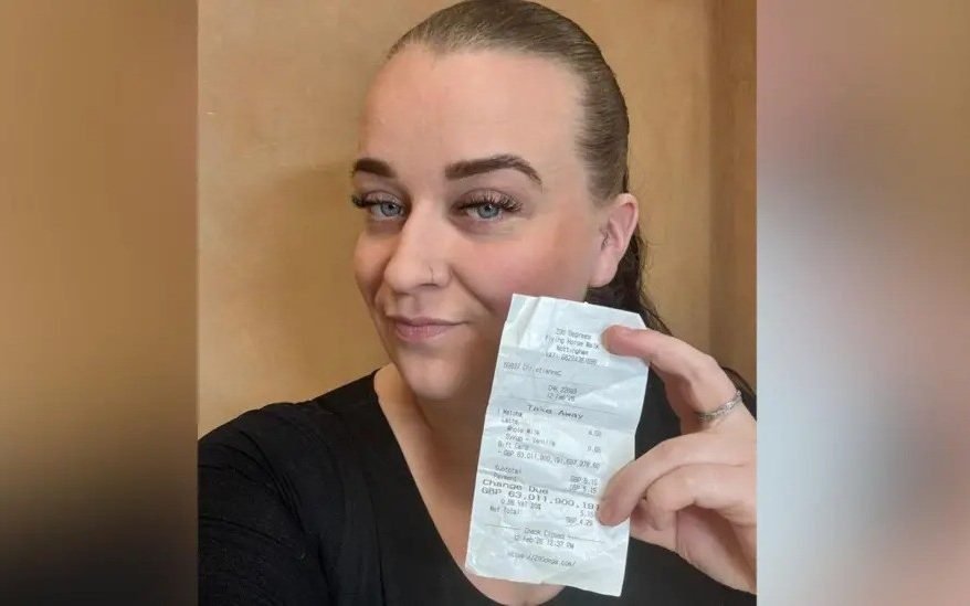 A woman holding a coffee cup with a shocked expression, surrounded by stacks of money and a laptop with a glitching screen, highlighting the coffee shop glitch that changed her life