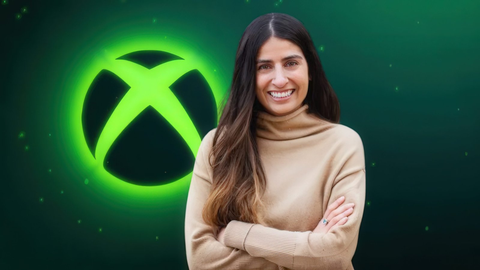 Asha Sharma, the new CEO of Microsoft Gaming, poses for a photo with a gaming console, sparking controversy over her alleged use of an AI bot to create her gamertag, as the gaming community continues to analyse her behaviour and intentions, with a focus on the Xbox gaming industry