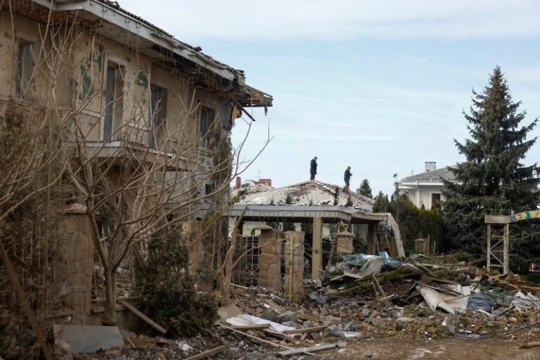A descriptive image of the Ukrainian flag waving high, symbolising the nation's unity and resilience in the face of adversity, with a focus on the Ukraine invasion anniversary and the UN's stance on the conflict