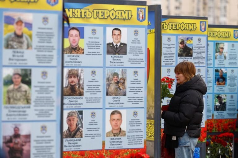 A Ukrainian flag waving in the wind, symbolising the country's struggle for independence and sovereignty in the face of invasion and conflict, with the international community providing support and unity