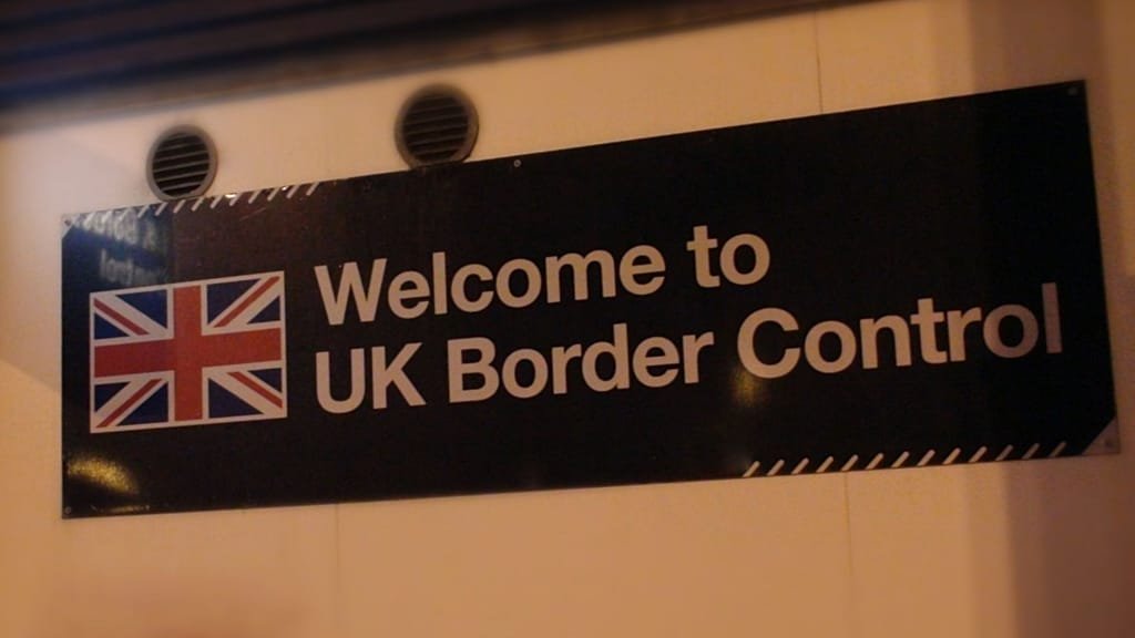 A person holding a tablet with the ETA travel permit application on the screen, with a background of a UK flag and a plane taking off, representing the new Electronic Travel Authorisation system for visitors to the UK