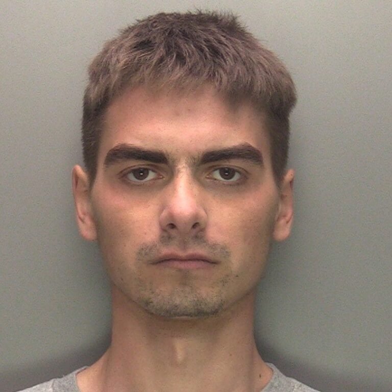 A sombre image of a UK immigration office, with a subtle background of a person struggling with mental health issues, highlighting the primary keyword 'schizophrenia and migration'