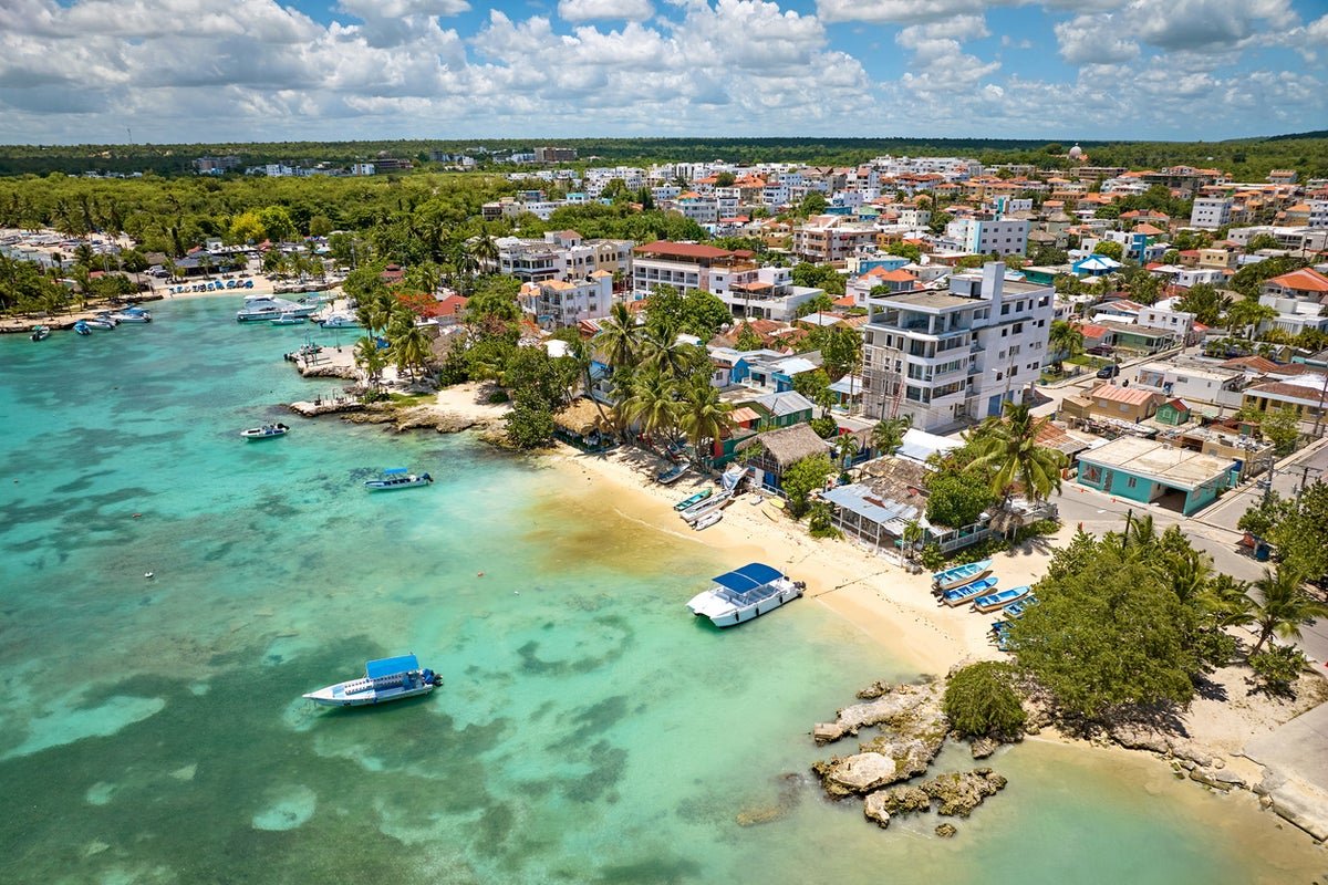 A woman being arrested at a karaoke night in a UK tourist hot spot for disrespecting the national anthem, with a crowd of people looking on in shock and outrage, highlighting the importance of respecting national symbols in the UK