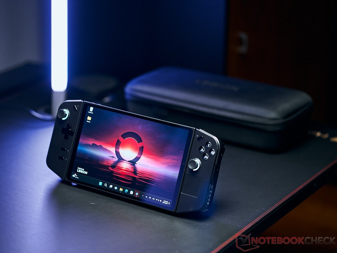 The Asus ROG Ally handheld gaming device with a vibrant display, showcasing its colour and detail, with the UK cityscape in the background, highlighting the device's portability and graphics capabilities