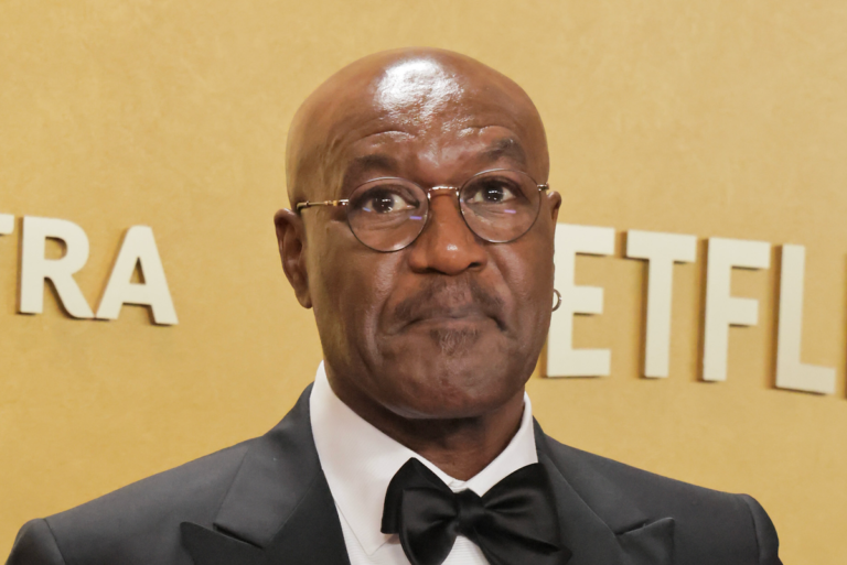 Delroy Lindo looking shocked and disappointed after hearing the Baftas racial slur, with a mix of emotions on his face, including sadness and frustration, as he reflects on the impact of racial slurs on behaviour and wellbeing, and the importance of promoting diversity and inclusion in the entertainment industry, with a colourful background that represents the diversity of the industry
