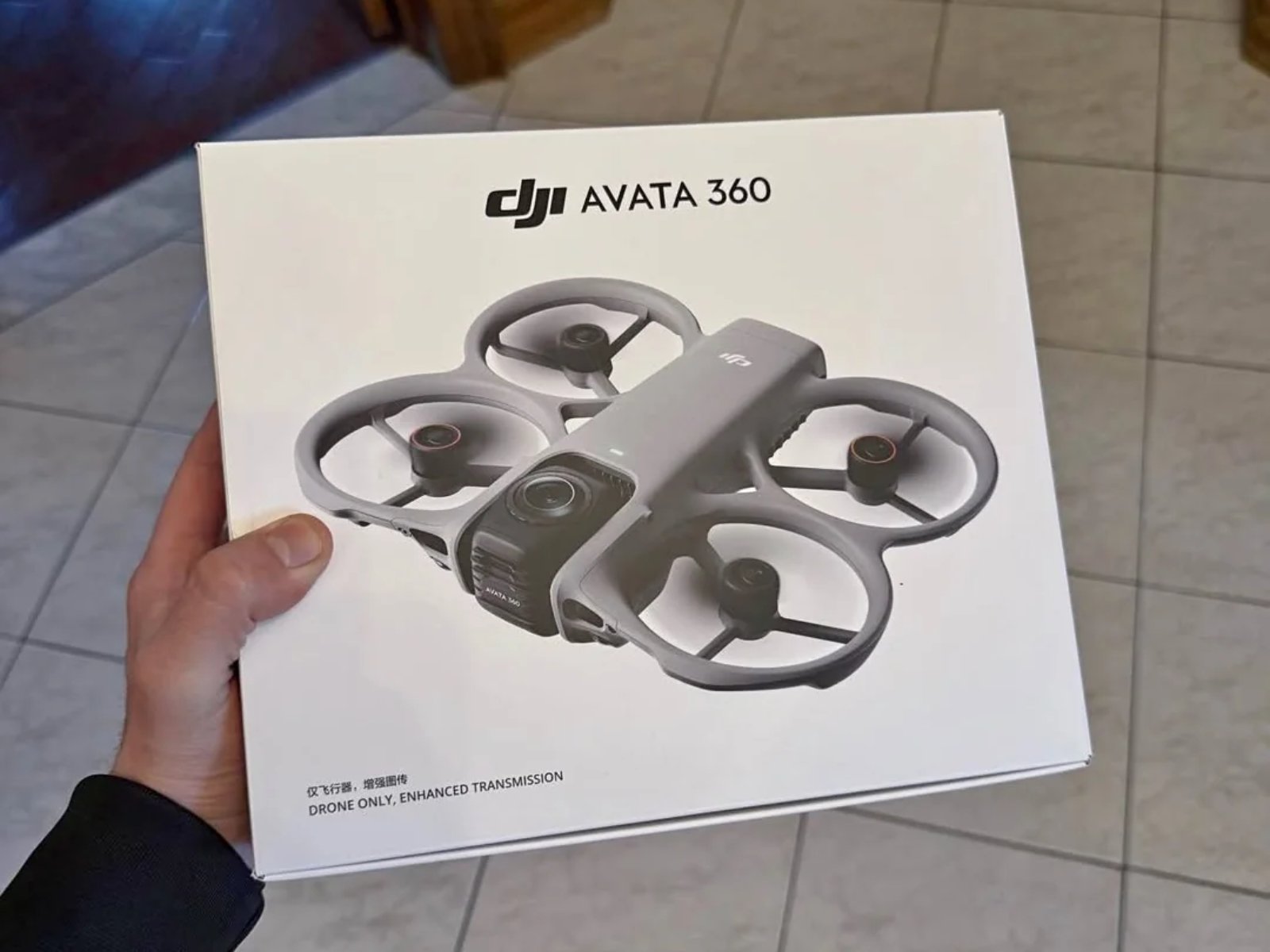 The DJI Avata 360 drone in flight, showcasing its unique design and impressive camera feature, a significant improvement over the Antigravity A1, with its colour scheme and behaviour on full display