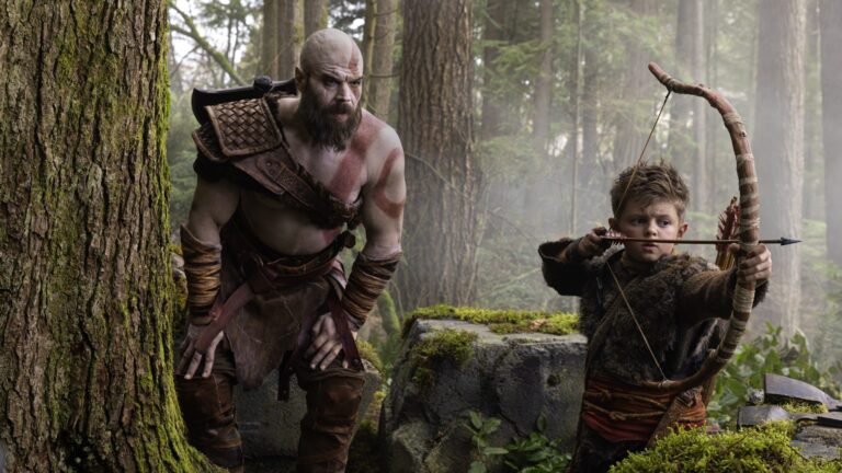 Kratos and Atreus stand together, ready for battle, in a scene from the God of War TV series, showcasing the intricate costumes and detailed environments, with a focus on the primary keyword, God of War TV series, in the UK production