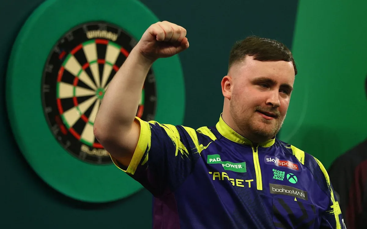Luke Littler in darts action
