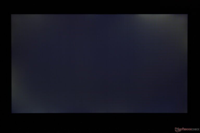 The LG Gram Book 15 laptop open on a desk with a blurred background, showcasing its sleek design and lacklustre display, a major drawback for this budget-friendly option in the UK, with a primary focus on its IPS display