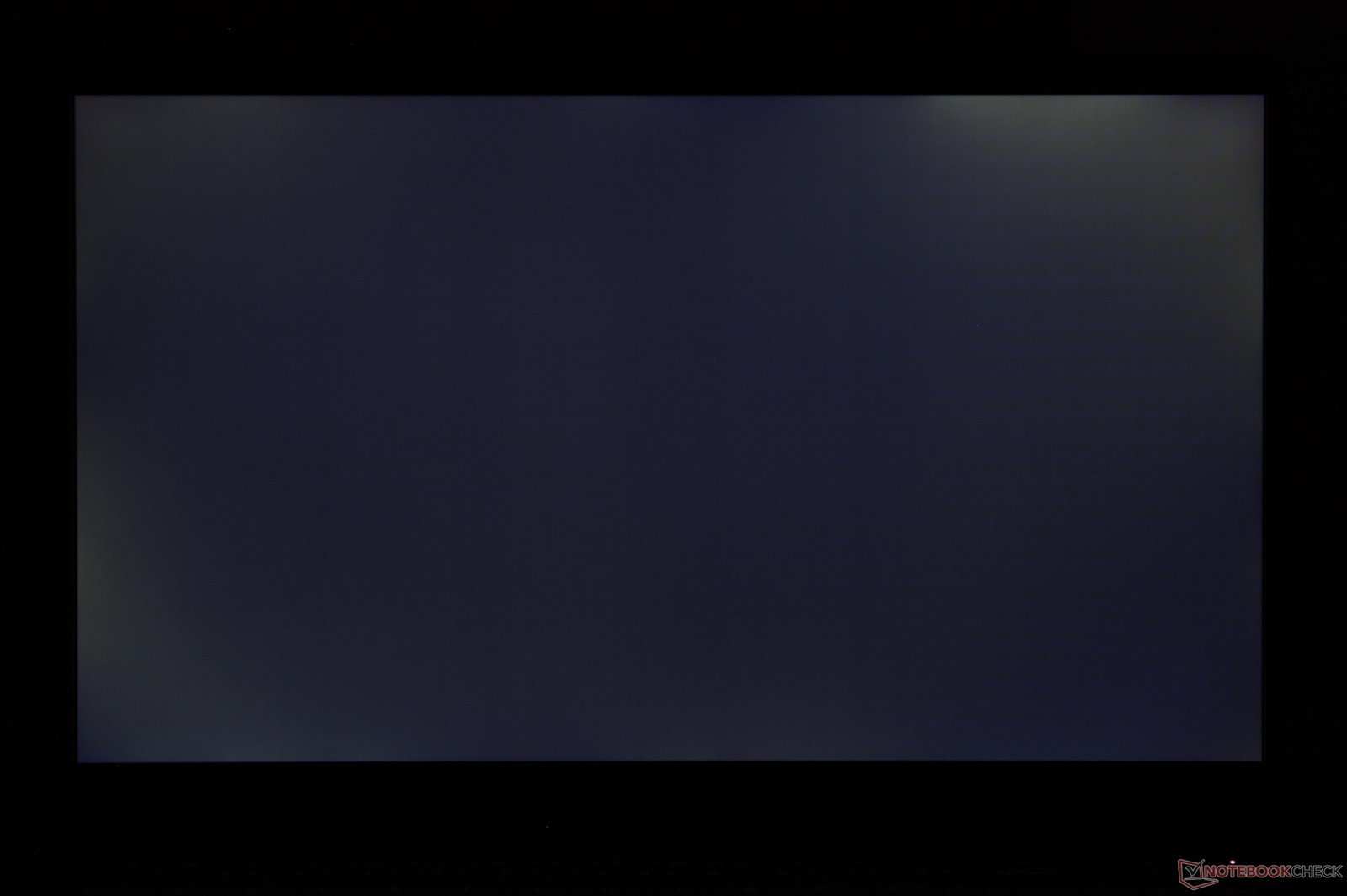 The LG Gram Book 15 laptop open on a desk with a blurred background, showcasing its sleek design and lacklustre display, a major drawback for this budget-friendly option in the UK, with a primary focus on its IPS display