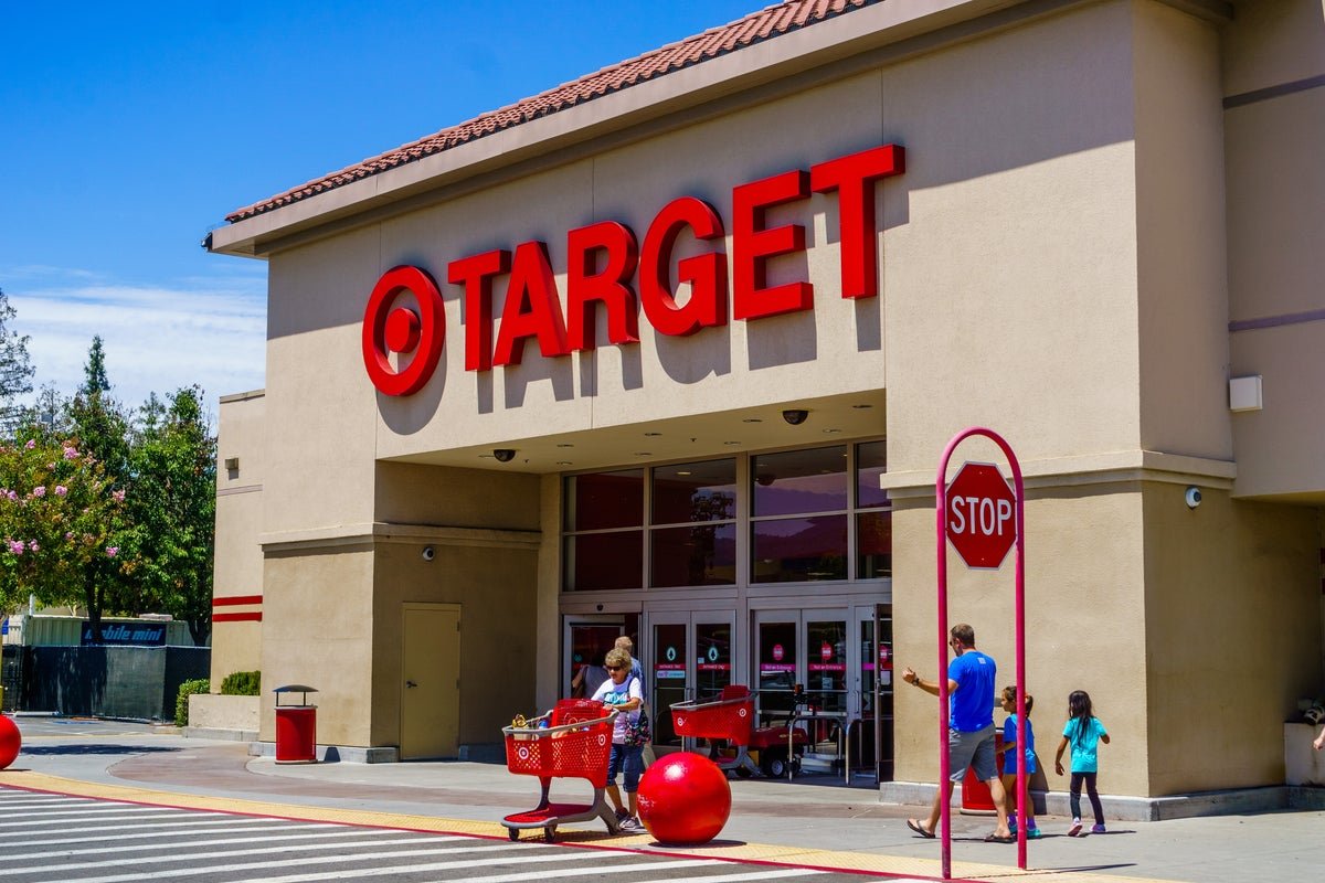 A photo of a man holding a packet of taco seasoning, with a blurred background of a Target store, highlighting the unusual method used to steal goods, with the primary keyword 'taco seasoning packets' featured naturally