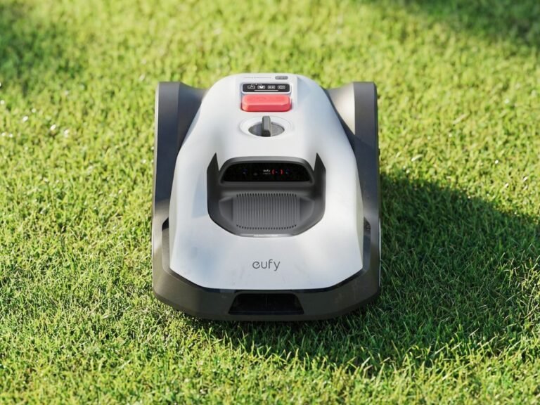 The eufy C15 robotic lawn mower in action, cutting grass with precision and ease, showcasing its sleek design and advanced navigation system, perfect for smaller UK yards and gardens, with a focus on robotic lawn mower technology