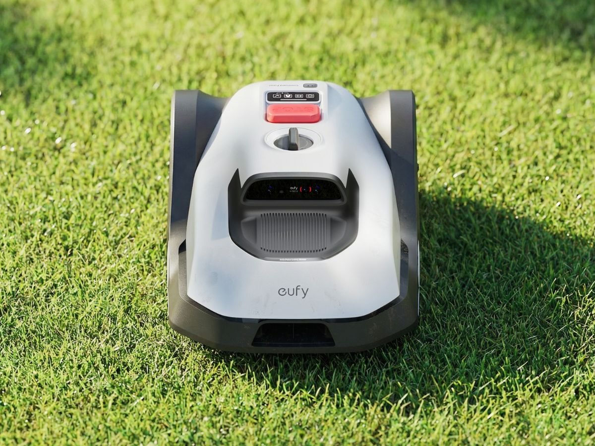 The eufy C15 robotic lawn mower in action, cutting grass with precision and ease, showcasing its sleek design and advanced navigation system, perfect for smaller UK yards and gardens, with a focus on robotic lawn mower technology