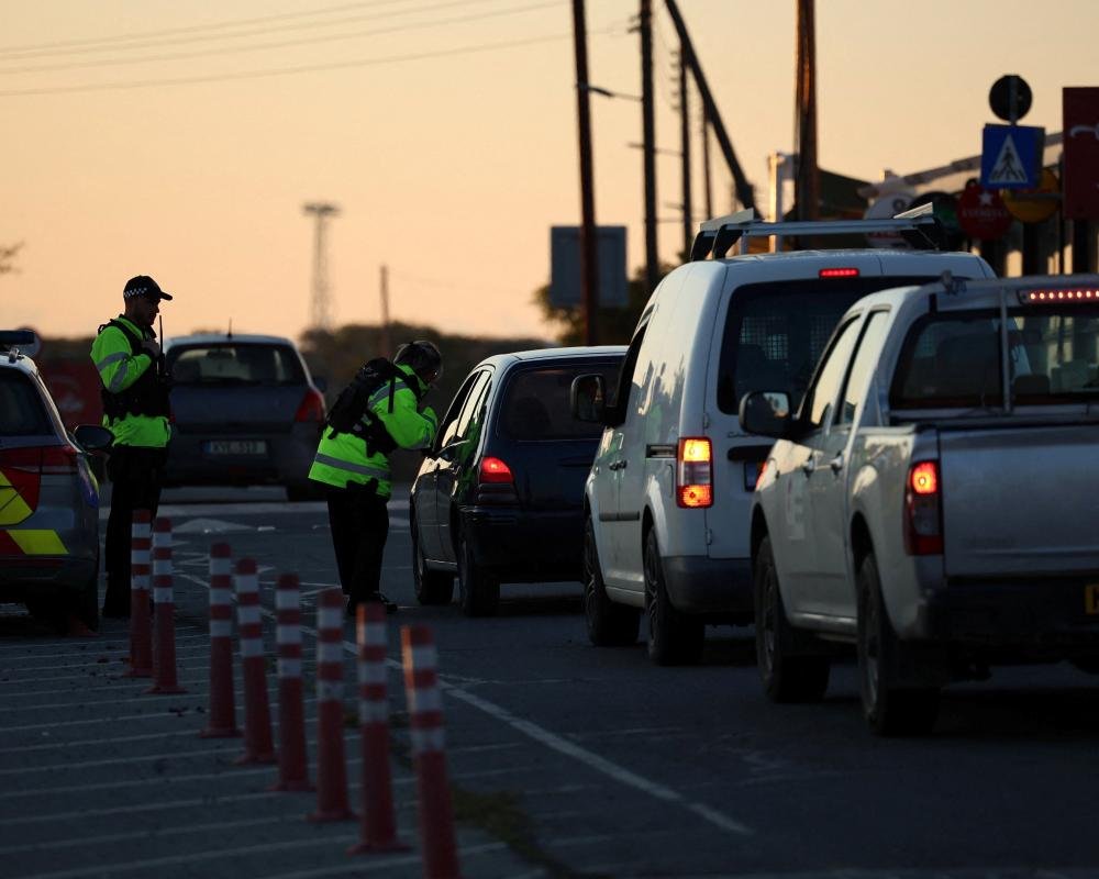 Aerial view of the UK RAF airbase in Cyprus, with a drone flying in the background, highlighting the vulnerability of the facility to drone strikes and the need for effective security measures