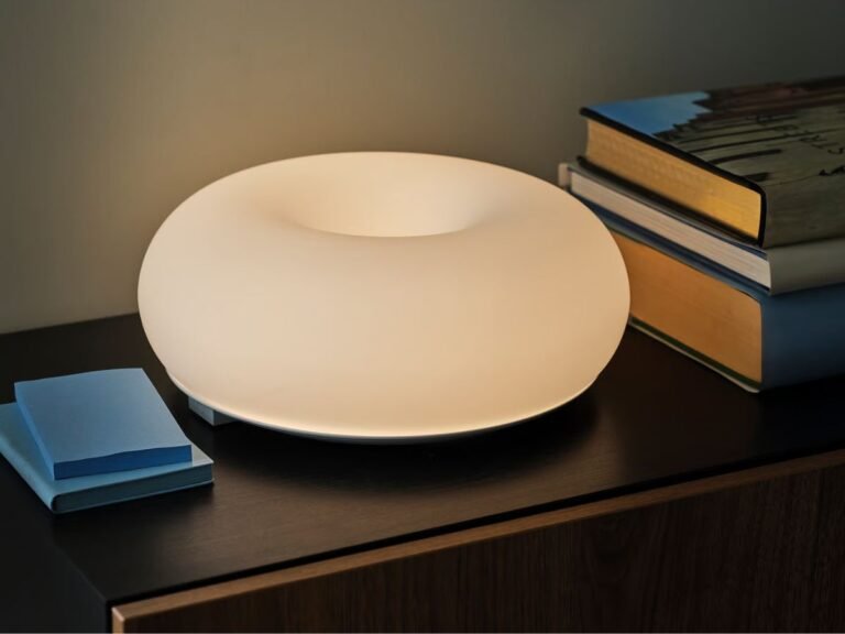 The Varmblixt LED lamp is a donut-shaped, dimmable smart/white glass colour and white spectrum lamp, available in the UK. With its 30 cm diameter, this lamp is the perfect addition to any home or office, offering a unique and stylish design that is sure to enhance any room. The lamp's donut shape is not only aesthetically pleasing but also provides a unique lighting experience, making it an ideal choice for those looking to create a warm and inviting atmosphere.