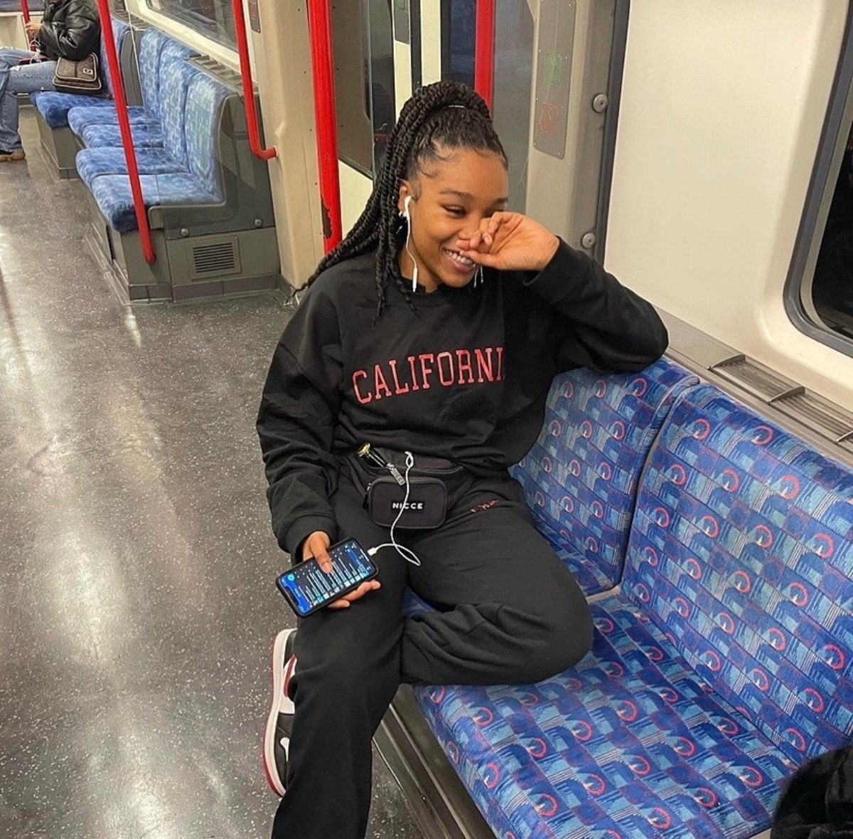 A Londoner in court, facing conviction for blackmail over false rape claims against a banker in Hong Kong, with a mix of emotions on her face, from sadness to regret, as she realises the seriousness of her actions