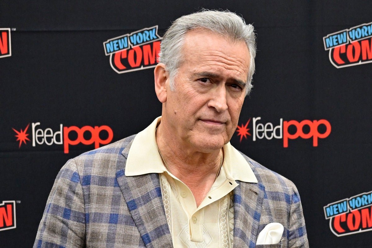Bruce Campbell, star of the Evil Dead franchise, smiles bravely as he reveals his shocking cancer diagnosis, inspiring fans with his strength and resilience in the face of adversity, with a glimmer of hope and colour in his eyes
