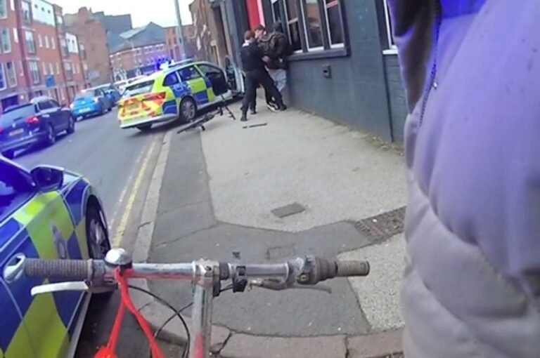 A descriptive image of a police officer recovering a stolen bike in Nottingham city centre, with a focus on the primary keyword 'stolen bikes'