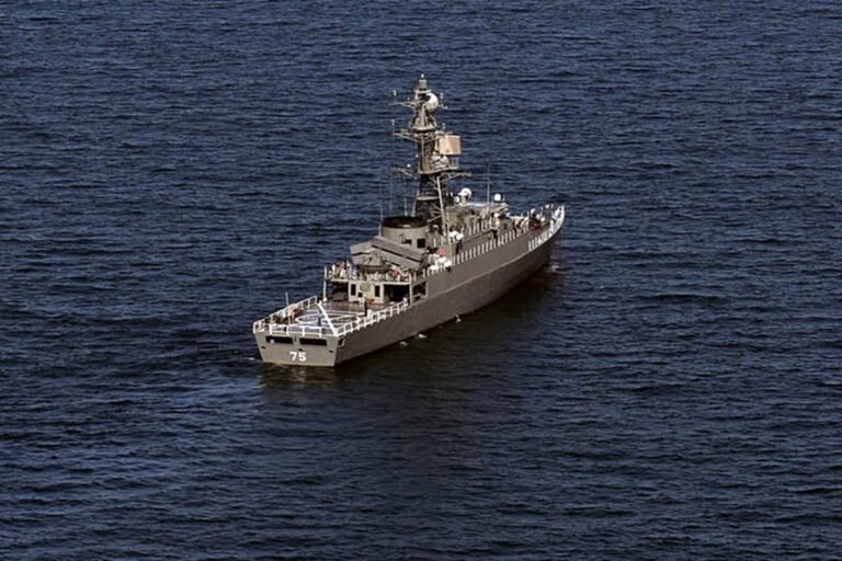 A US submarine is seen in the distance, with the Sri Lankan coast visible in the background, as the primary keyword 'US submarine' is naturally included in this descriptive alternative text for the featured image