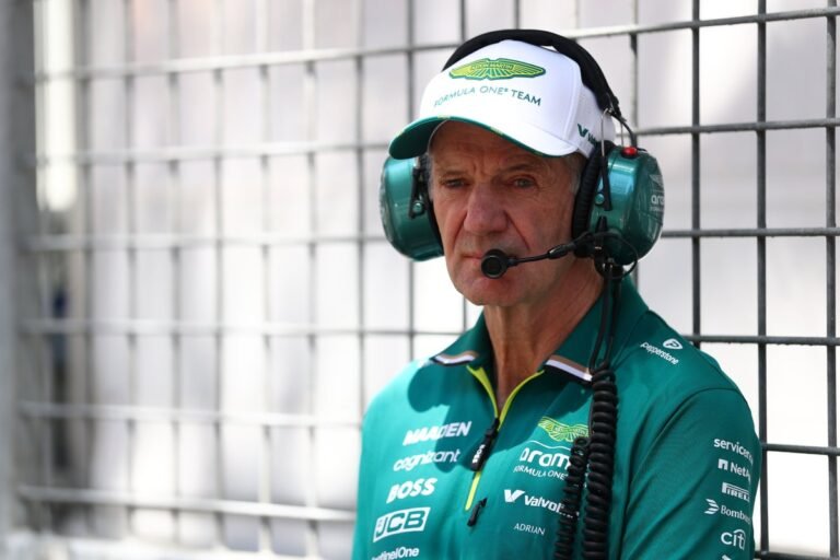 Aston Martin's Formula 1 car navigating a high-speed corner at the Australian Grand Prix, with a focus on driver safety and the potential risks of nerve damage, the team's primary concern is the well-being of its drivers