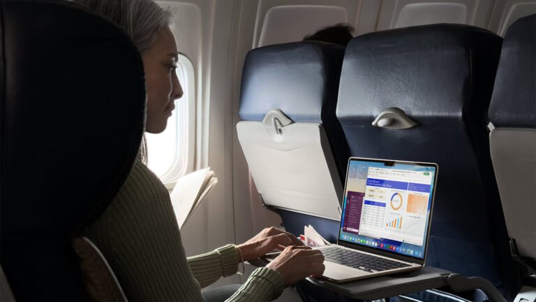 A close-up of a MacBook Air with a blurred background, showcasing the device's sleek design and vibrant colour display, with the primary keyword being MacBook Air