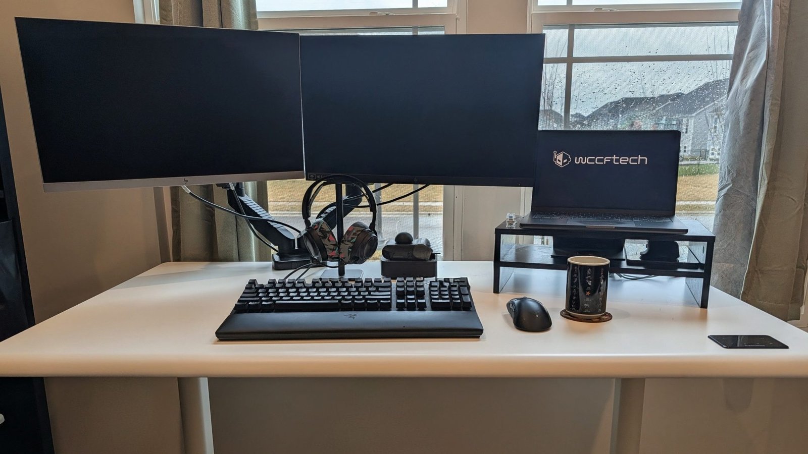 The Autonomous Desk 5 Pro and ErgoChair Ultra in a modern home office setting, with a laptop and other work essentials on the desk, showcasing the products' sleek design and ergonomic features, perfect for enhancing productivity and comfort in the UK