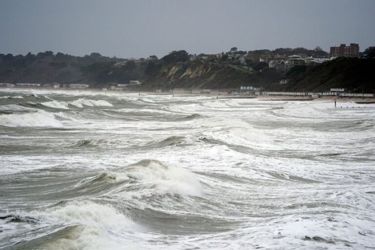 UK Christmas swimmers in rough seas