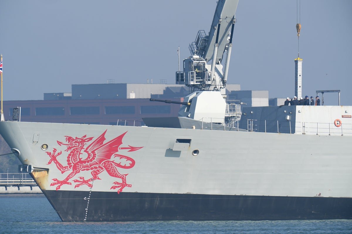 A Royal Navy ship at sea, with a subtle hint of tension in the background, conveying the uncertainty surrounding its delayed deployment to Cyprus after the Iran strike, with the primary keyword 'Royal Navy' featured prominently