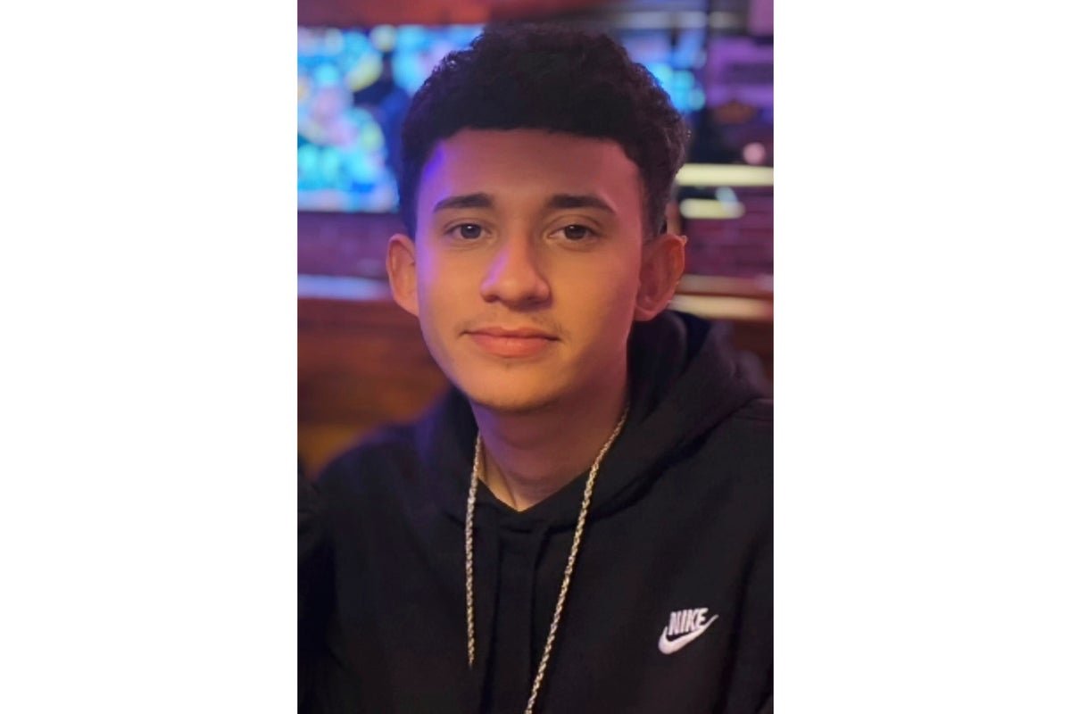 A mother holds a photo of her son, an American citizen who was killed by ICE, with a sombre expression, highlighting the human impact of ICE's actions and the need for accountability and reform within the organisation, with a focus on the primary keyword of ICE