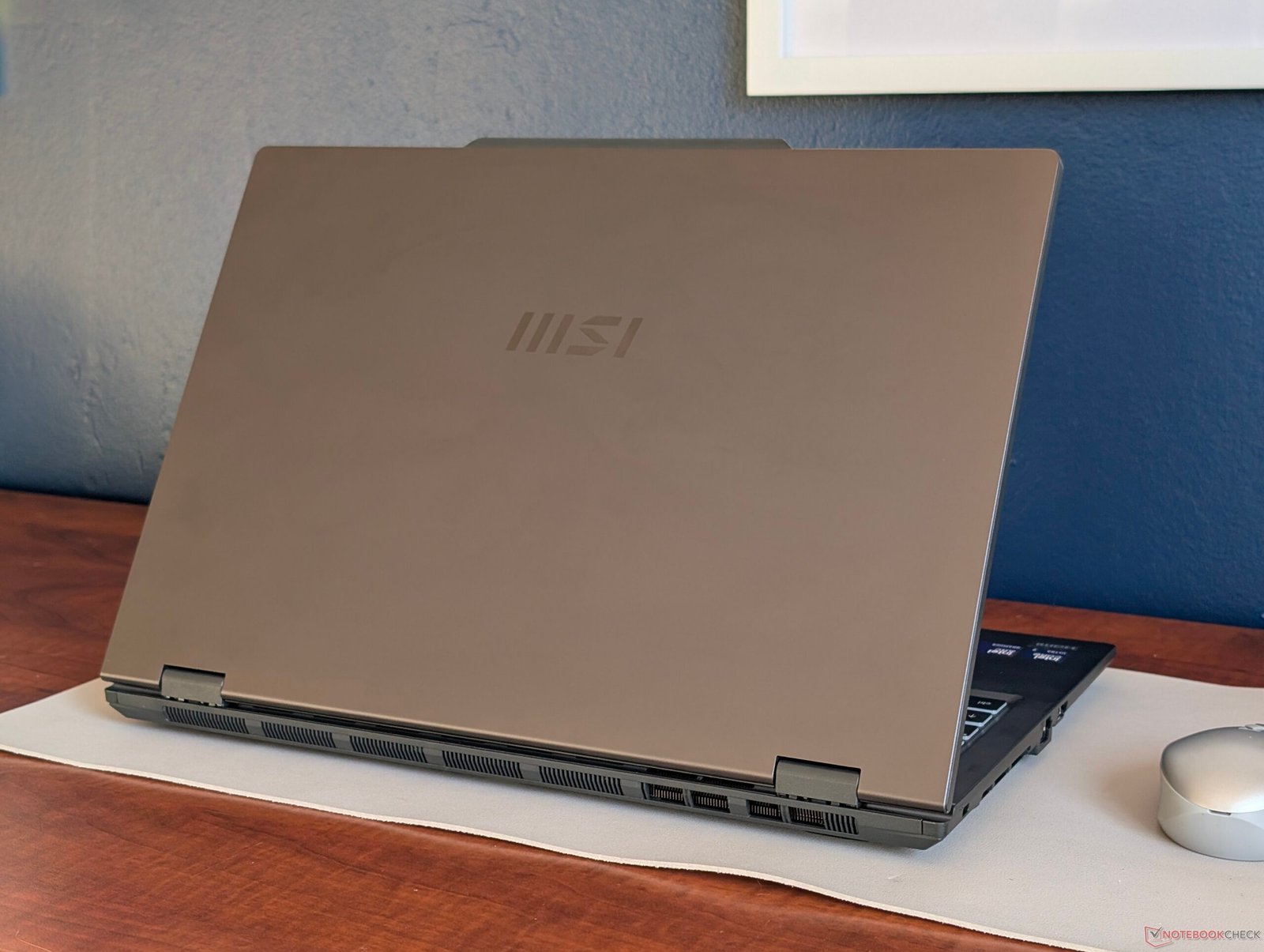 The MSI Venture 16 office laptop, featuring a sleek and professional design, perfect for UK businesses and individuals seeking a reliable and affordable computing solution, with a colour scheme that fits any office environment, and a primary keyword of office laptop