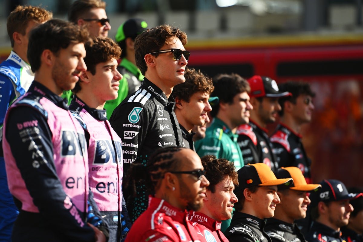 The Australian Grand Prix starting grid, featuring a range of F1 cars and drivers, with a colourful and exciting atmosphere, and a primary focus on the Formula 1 racing event