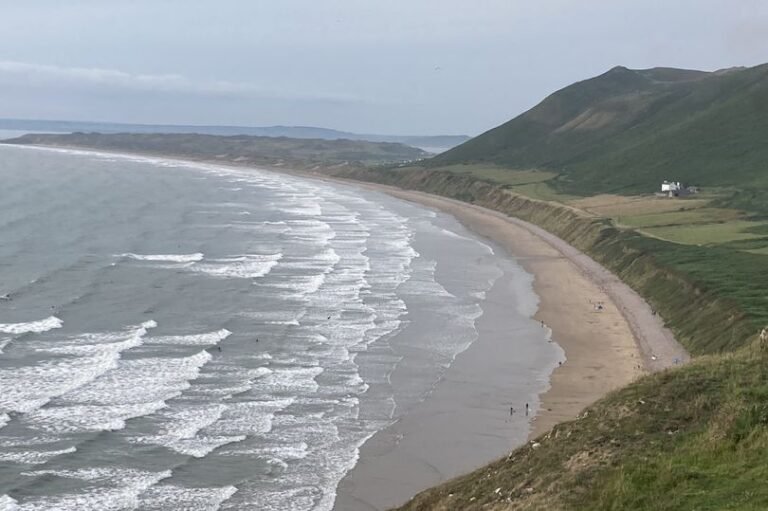 A picturesque Welsh beauty spot with rolling hills and serene atmosphere, where a man's body was recently discovered, sparking a police investigation into the mysterious death