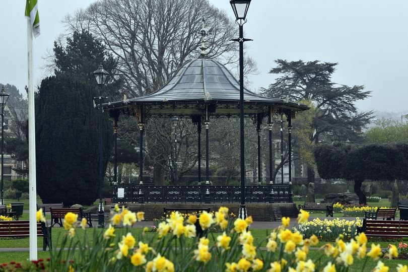 A scenic view of a Welsh county park at sunset, with people enjoying the outdoors, highlighting the beauty of these community spaces and the importance of safety and responsible behaviour