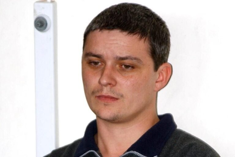 A sombre image of a funeral or memorial service, symbolising the mourning and reflection that follows the death of a notorious figure like Ian Huntley, with a focus on the primary keyword of justice