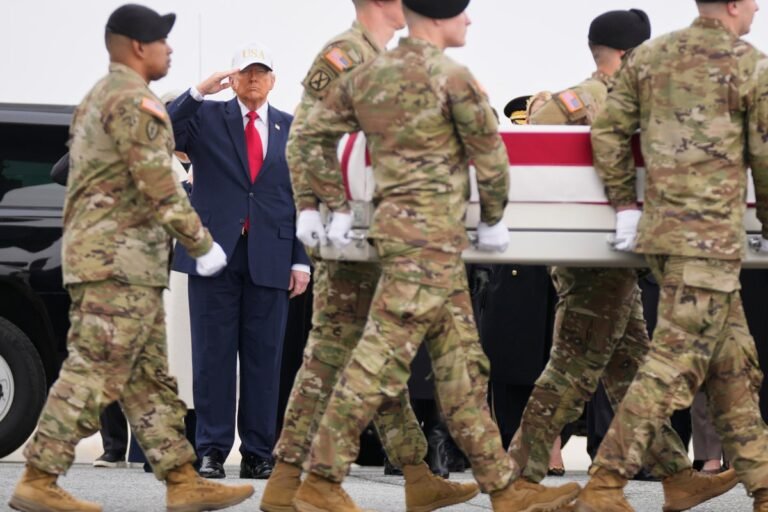 A sombre and respectful image of a US service member, with a subtle background of the Iranian flag, symbolising the complex and sensitive nature of the conflict, with a focus on the primary keyword phrase Iran war
