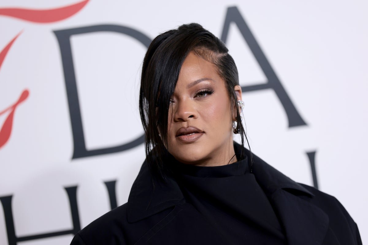 Rihanna shooting suspect charged with attempted murder, a descriptive image of a police car outside Rihanna's home with a primary keyword of celebrity security