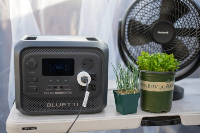 The Bluetti Elite 300 portable power station, featuring a compact design and solar panel, perfect for camping and outdoor adventures in the UK, with a focus on renewable energy and sustainable living