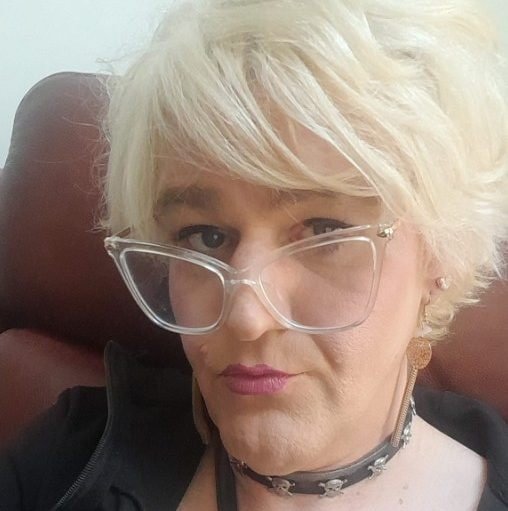 A person sitting in front of a computer, with a concerned expression, highlighting the importance of online safety and the potential risks of grooming, particularly in the trans community