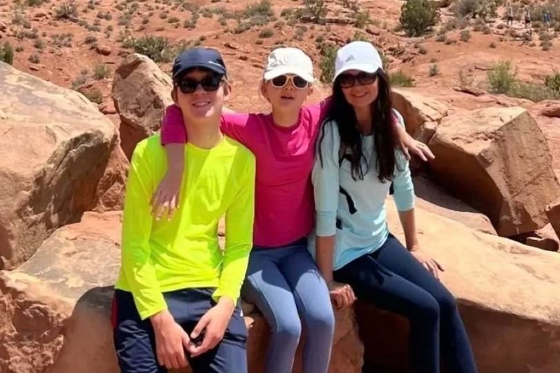 A sombre and heartbreaking scene in a Welsh town, where a mother and her two young children lost their lives in a tragic incident, with the primary keyword 'Welsh family tragedy' naturally included