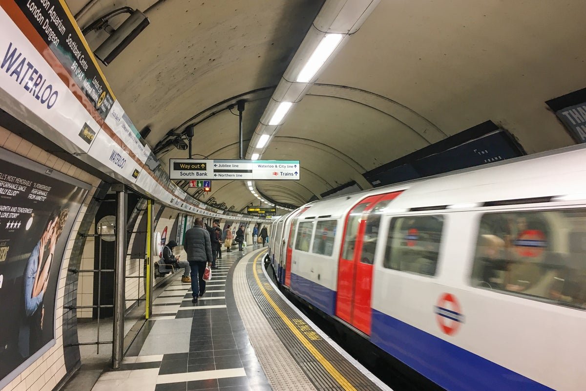 London Tube strike: a crowded platform with frustrated commuters waiting for trains, highlighting the chaos and disruption caused by the walkouts, with a focus on Tube strikes