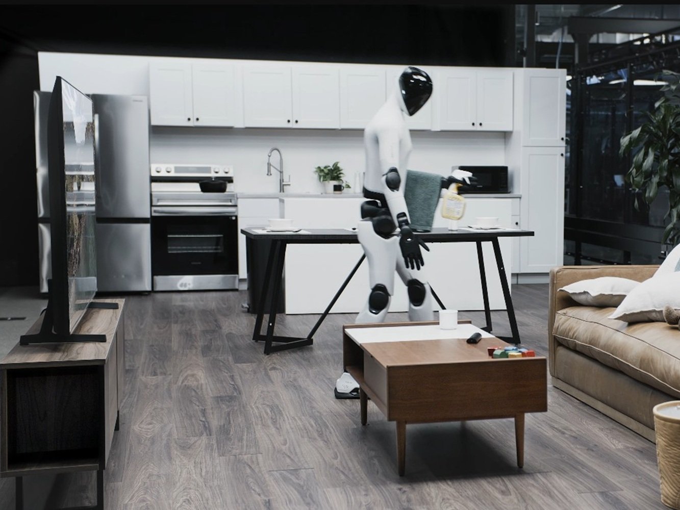 A humanoid robot powered by Helix 02 cleaning a living room autonomously at human speed, showcasing the latest UK robotics breakthrough in autonomous robots for household chores