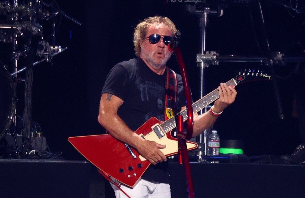Sammy Hagar and Alex Van Halen performing on stage with Van Halen, showcasing their unique sound and energetic live performances, with a focus on their musical feud and the colour of their music